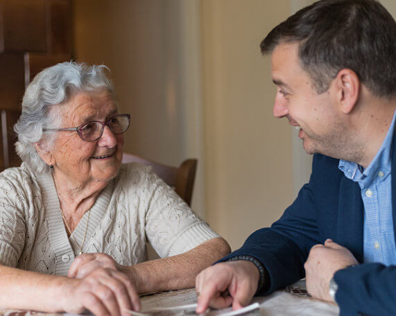 Senior woman discussing her Medicaid planning with an elder law attorney