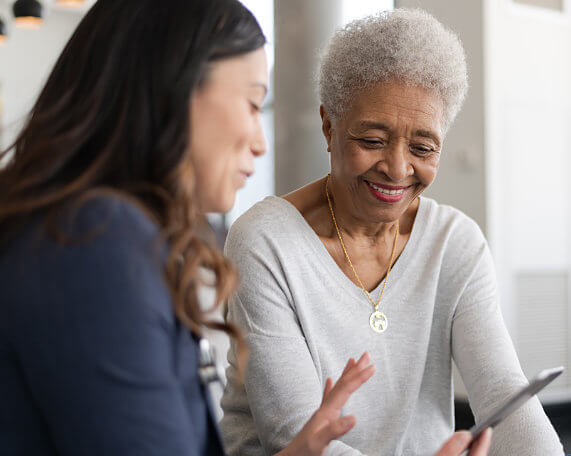 square photos Medicaid Attorney working with senior woman to go over Medicaid options