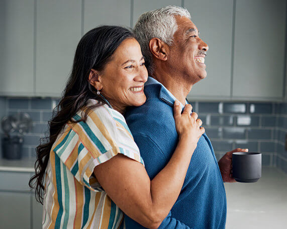 square photos Smiling senior couple in their kitchen