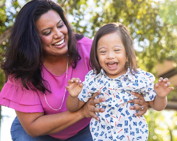 Mother with son in a park who will need a special needs trust