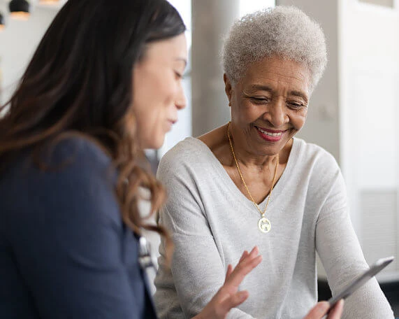 Medicaid Attorney working with senior woman to go over Medicaid options