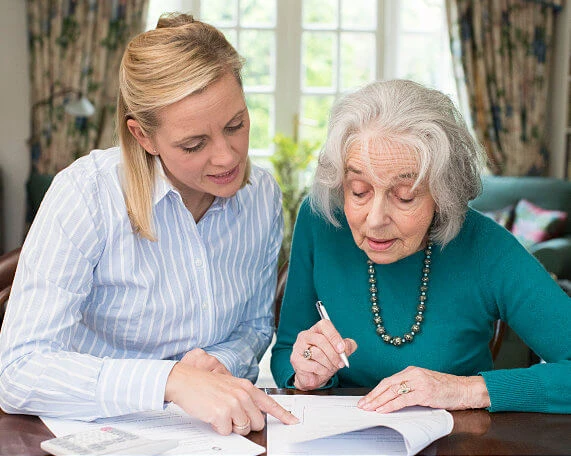 Senior woman discussing wills and trusts with a Michigan elder law attorney